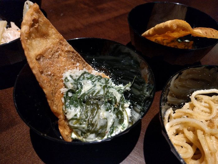 A tasting of the artichoke dip and lobster pasta